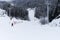 Instructor teaches the child to ski on the ski slope