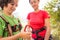 The instructor teaches the child to use climbing equipment