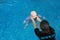 Instructor training dummy drowning baby doll in the pool