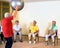 Instructor working with senior ladies in a gym.