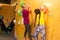 Instructors helping children climb wall in gym