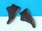 Insulated black casual sport men`s shoes on blue and blue background. Men`s shoes for cold weather. Flat lay