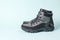 Insulated men`s stylish walking shoes for travel on a blue background.