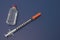 Insulin and capped syringe