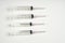 Insulin and large syringe, white background