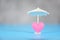 Insurance Health concept - White umbrella on pink heart healthcare on blue background