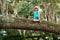 Insurance kids. Child sitting on tree branch. Cute kids boy climbing on the tree.