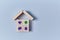 Insurance policy. Healthcare. Investment insurance. Health protection. House miniature made of cube. Copy space on blue