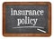 Insurance policy text on blackboard