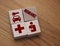 Insurance word and icons symbolizing risks of illness or injury on 4 wooden cubes. Healthcare and Medicine Insurance Concept
