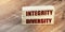 Integrity Diversity words written on wooden blocks. Equal rights social concept