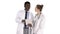 Intellectual healthcare professional afro american doctor with collegue using digital tablet on white background.
