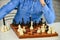 Intellectual hobby. Figures on wooden chess board. Thinking about next step. Development logics. Chess is life in