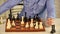 Intellectual hobby. Figures on wooden chess board. Thinking about next step. Strategy concept. School teacher. Board