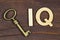 Intelligence quotient, iq test concept, key with letters on a wooden background