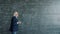 Intelligent professor working at project in college writing formulas on chalkboard wall