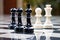 Intense Battle: Black and White Chess Pieces on Marble Chessboard