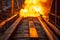 intense blaze at end of manufacturing conveyor belt