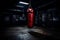 Intense Clash: Red Punching Bag Meets Black and Blue Boxing Gloves