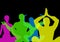 Intense color silhouettes doing yoga with opacity. Black background