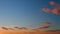 Intense dramatic panoramic sunset. Abstract different shades clouds at sunset sky background. Timelapse.