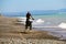 Intense motorbike race taking place on the scenic shoreline of Cape Kidnappers in New Zealand