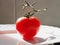 Intense red tomato under sunlight isolated on a plate