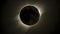 Intense solar eclipse zoom telephoto lens dark surroundings topdown angle