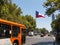 Intense traffic on Avenida La Alameda, the most important street in Santiago de Chile. In the background, the flag of Citizenship