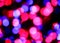 intentionally blurred background of many colorful lights of red fuchsia blue colors ideal background