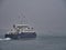 The inter-island car ferry Leirna leaving Lerwick in Shetland for the island of Bressay on a dark, misty, rainy day.