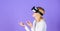 Interact alternative reality. Digital device and modern opportunities. Woman head mounted display violet background