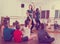 Interested children rehearsing ballet dance in studio