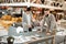 Interested couple observing quality of table presented in store