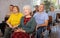 Interested elderly woman listening lesson during language courses