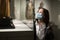 Interested preteen girl in protective mask exploring artworks in museum