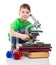 Interested small boy with microscope