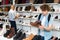 Interested teenage boy choosing spring and autumn shoes in shop