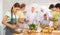 Interested teenage girl participating in culinary class of children group