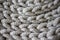 Interesting background made of crochet hand-made, gray cotton cord