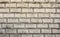 Interesting beige bricks in organized rows, perfect for texture or background with copy space.