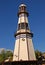 Interesting lighthouse tower landmark with moorish design rounded dome top in seaside town Puerto Del Carmen, Lanzarote, Spain