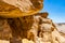 Interesting shapes trails surrounded by caves, rocks, cliffs of ancient cooper mines canyons and mountains range in Timna National