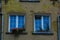 Interesting windows in old historic tenement houses in the Polish city of Gdansk close up