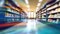 Interior of an abstract, blurry college library. Bookshelves and a classroom in blurry focus. use as a backdrop or background in