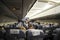 Interior of airmoldova airplane with passengers on seats and stewardess walking the aisle