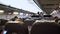 Interior of airplane with passengers on seats waiting to taik off.