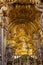 Interior and altar of historic church all painted in gold with baroque architecture