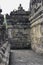 Interior of ancient Borobudur temple lower terraces empty narrow corridor with reliefs on the wall