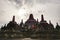 Interior of ancient Borobudur Temple. View of upper stupas with cloudy sky.